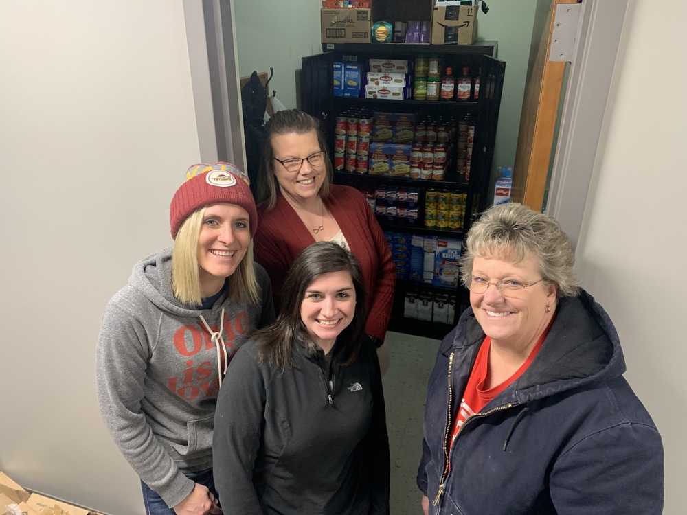 Four women and food pantry